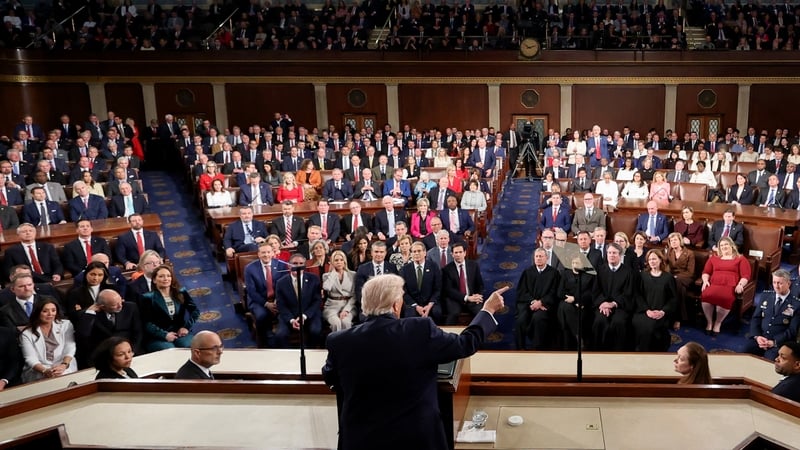 a view from behind donald trump as he makes a speech