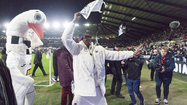 Swansea City AFC club co-owner Snoop Dogg walks around the pitch prior to the Sky Bet Championship match between Swansea City and Preston North End
