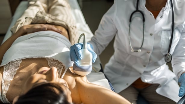 A young woman is doing a breast ultrasound for preventive breast cancer care