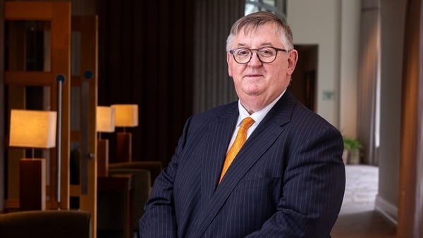 Matt O�Connor, Managing Director of the Mullingar Park Hotel, stands with hands folded in a navy jacket, yellow tie and wearing glasses
