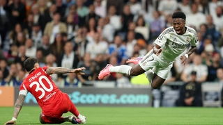 Vinicius Junior of Real Madrid reacts after clashing with Nicolas Otamendi of Benfica