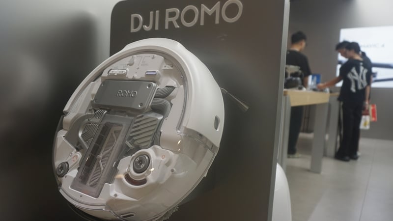A DJI robotic vacuum cleaner ROMO showcased in a shop
