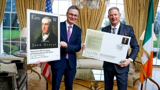 Communications Minister Patrick O'Donovan and US Ambassador to Ireland Edward Walsh pictured with a stamp to mark 250 years of American independence