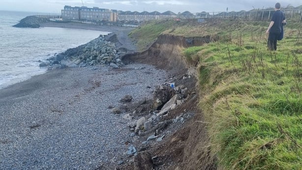 A man stand on the edge of a section of the Bray-Greystones cliff walk