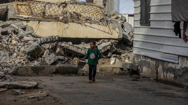 KHAN YUNIS, GAZA - DECEMBER 12: Palestinians, living in the southern Gaza city of Khan Yunis, under blockade, carry on with their daily lives amid the rubble left by Israeli attacks on December 12, 2025. Residents are trying to survive in makeshift tents