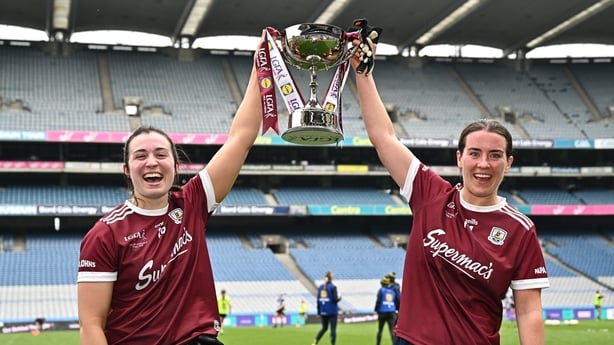 Galway players Leanne Coen, left, and Roisin Leonard celebrate with the cup after their side's victory in the Lidl Ladies National Football League Division 2 final match between Cork and Galway at Croke Park in Dublin.