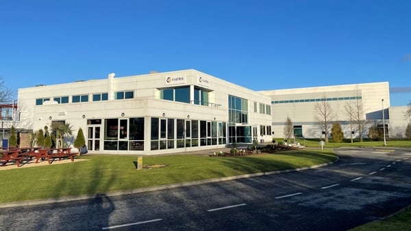 Image of a pharma manufacturing plant with a blue sky in the background
