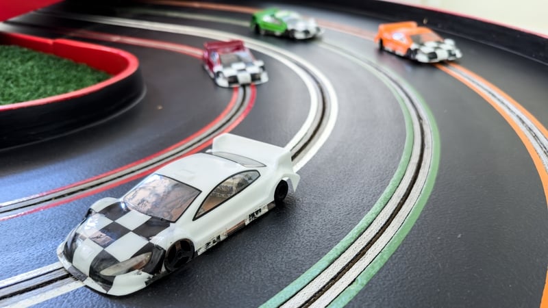 Models of toy cars on a racing track