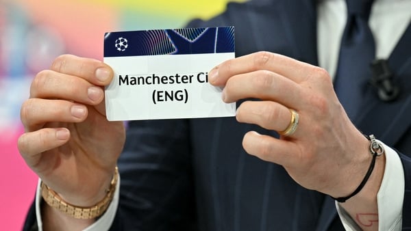 UEFA Foundation for Children ambassador and former Sevilla midfielder, Ivan Rakitic holds up the slip of Manchester City (ENG) during the 2025-2026 UEFA Champions League round of 16, quarter-final and semi-final draw at the House of European Football in N