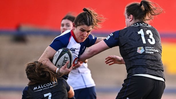 25 January 2026; Erin King of Wolfhounds is tackled by Glasgow Warriors players Gemma Bell, left, and Briar McNamara during the Celtic Challenge Round 5 match between Wolfhounds and Glasgow Warriors at Virgin Media Park in Cork. Photo by Shauna Clinton/Sportsfile 