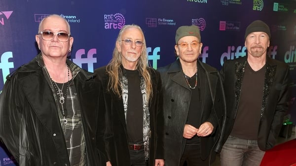 Guggi with friends Gavin Friday, Bono and The Edge pictured at the Dublin International Film Festival screening of Gug