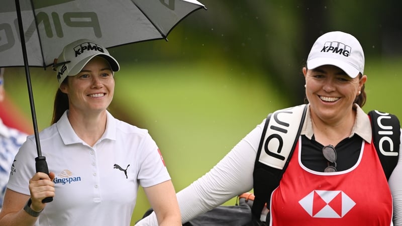 Leona Maguire of Ireland walks with her caddie Laura Gonzalez Escallon on the second hole during Day Two of the HSBC Women's World Championship 2026 at Sentosa Golf Club on February 27, 2026 in Singapore, Singapore.