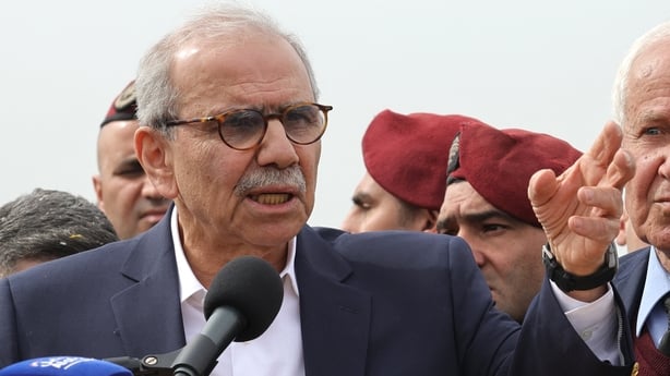 Lebanon's Prime Minister Nawaf Salam speaks to the residents and press corps during his visit to the heavily-damaged southern village of Kfar Shouba, near the border with Israel on February 8, 2026. Swathes of south Lebanon's border areas remain in ruins and largely deserted more than a year after a