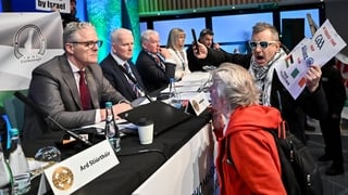 Uachtarán Chumann Lúthchleas Gael Jarlath Burns talking to anti Allianz protesters who gained access to the Congress floor during motions, before Congress was suspended for a time, during day two of the GAA Annual Congress at Croke Park in Dublin.
