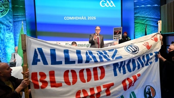 Uachtarán Chumann Lúthchleas Gael Jarlath Burns talking to anti Allianz protesters who gained access to the Congress floor during motions, before Congress was suspended for a time, during day two of the GAA Annual Congress at Croke Park in Dublin.
