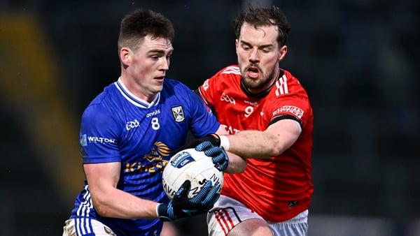 Ryan Brady of Cavan is tackled by Conor Early of Louth during the Allianz Football League Division 2 match between Cavan and Louth at Kingspan Breffni in Cavan.