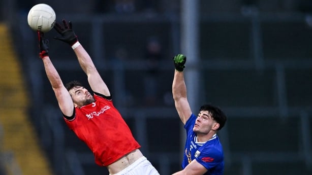 Dermot Campbell of Louth and Oisin Brady of Cavan contest a fielded ball during the Allianz Football League Division 2 match between Cavan and Louth at Kingspan Breffni in Cavan. 