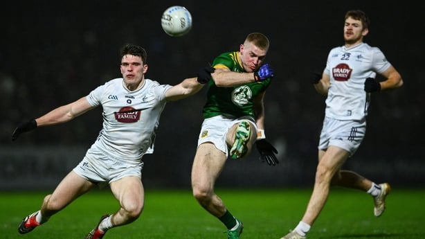 28 February 2026; Jack Flynn of Meath kicks a point despite the efforts of Brendan Gibbons of Kildare during the Allianz Football League Division 2 match between Kildare and Meath at Cedral St Conleth's Park in Newbridge, Kildare. Photo by Shauna Clinton/Sportsfile