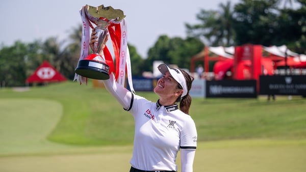 Hannah Green of Australia holds the trophy aloft after winning the HSBC Women's World Championship 2026 at Sentosa Golf Club on March 01, 2026 in Singapore, Singapore.