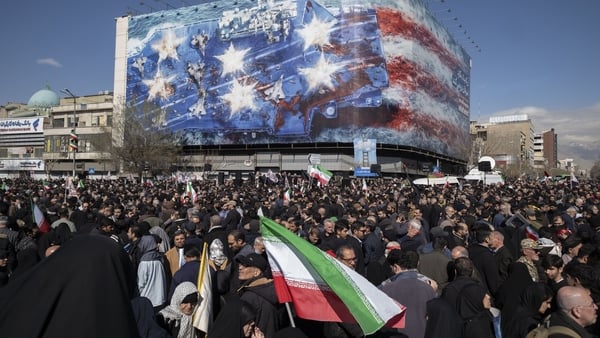 Pro-government supporters participate in a rally in Tehran, Iran