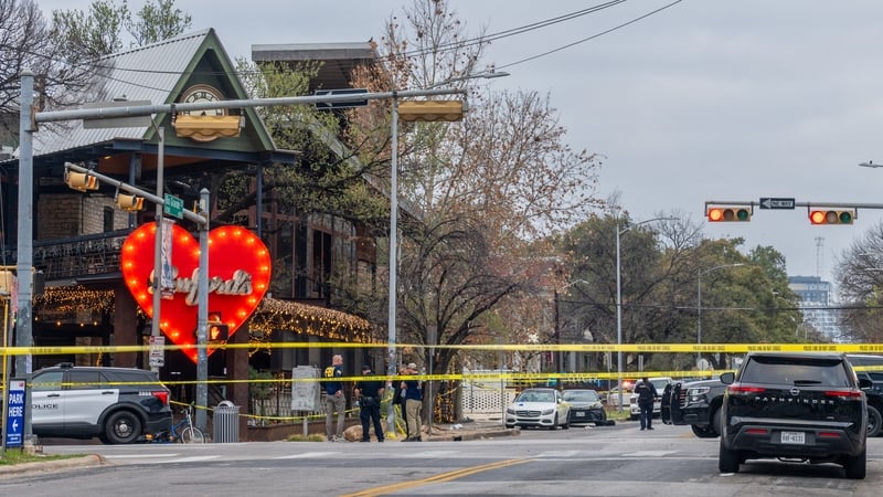 Members of the FBI and local law enforcement investigate after a mass shooting outside of Buford's bar in downtown Austin, Texas