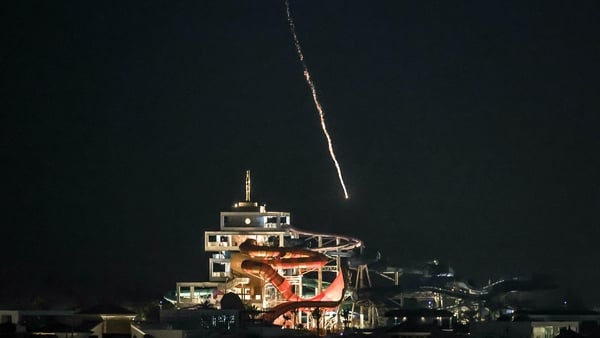An intercepted projectile falls into the sea near Dubai's Palm Jumeirah archipelago
