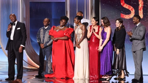 British-US actor Delroy Lindo (L) speaks as the cast of "Sinners" including actors Michael B. Jordan, Hailee Steinfeld, Wunmi Mosaku, Miles Caton, Li Jun Li and Jayme Lawson accept the award for Outstanding Performance by a Cast in a Motion Picture for "Sinners" during the 32nd Annual Actor Awards a