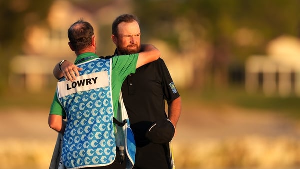 PALM BEACH GARDENS, FLORIDA - MARCH 01: Shane Lowry of Ireland and his caddie embrace on the 18th green during the final round of the Cognizant Classic 2026 at PGA National Resort And Spa on March 01, 2026 in Palm Beach Gardens, Florida. (Photo by Raj Meh