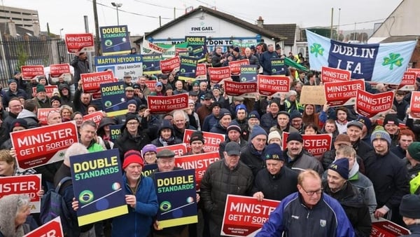 Crowd of protesters holding placards
