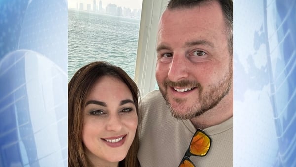 a photo of a man and woman smiling for the camera