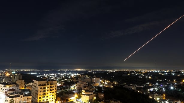 Iranian rocket trails are seen over Hebron in the Israeli-occupied West Bank 