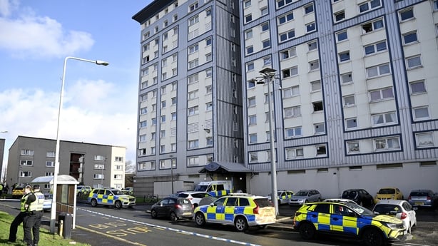 Police vehicles in front of a tower block in Calder, Edinburgh,