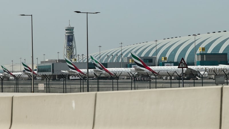 Emirates airline planes are parked on the tarmac at Dubai International Airport