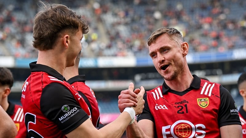 13 July 2024; Down players Caolan Mooney, 21, and Eamonn Brown celebrate after their side's victory in the Tailteann Cup Final match between Down and Laois at Croke Park in Dublin. Photo by Piaras Ó Mídheach/Sportsfile