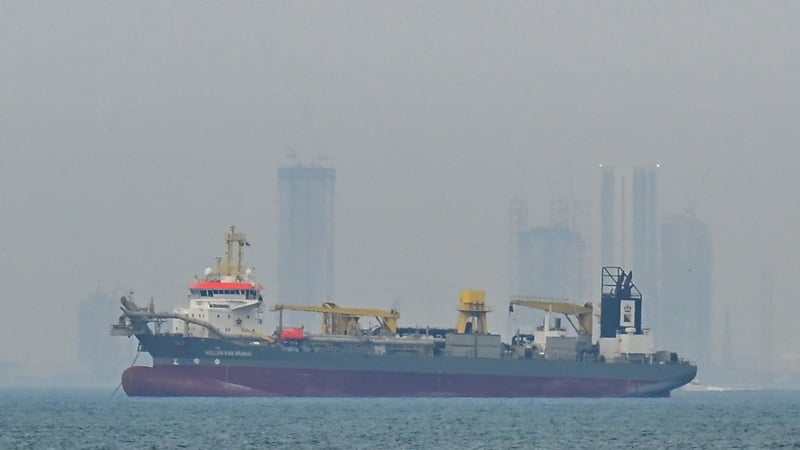 Commercial ships anchor off the coast of the United Arab Emirates due to navigation disruptions in the Strait of Hormu