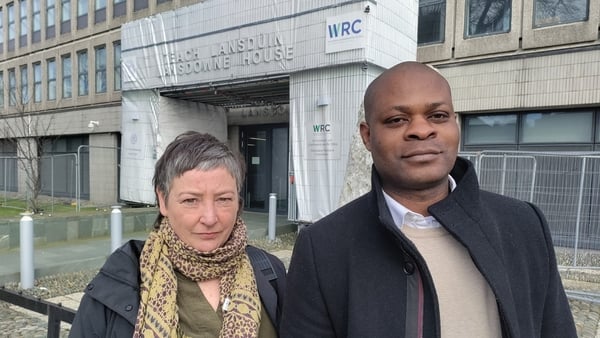 A man and a woman pose outside the WRC