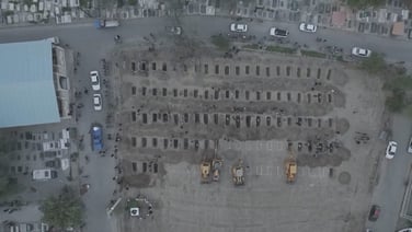 Drone footage shows excavators digging graves for victims of attack on girls' school in Iran