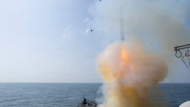 a tomahawk missile is fired from an aircraft carrier
