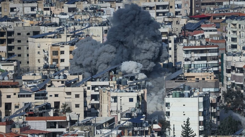 A plume of smoke rises from the site of an Israeli airstrike in the southern suburbs of Beirut's Haret Hreik neighboUrhood