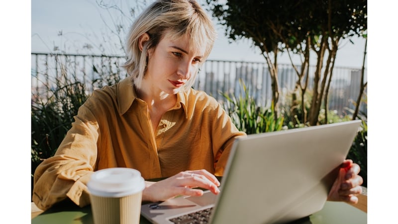 woman laptop balcony office outside