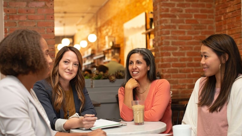 Four women working in a business meeting in a cafe coffee shop Photo by LinkedIn Sales Solutions on Unsplash
