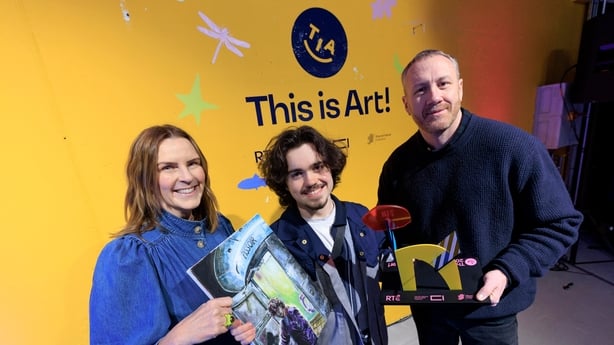 Suzanne Kelly, RTE's Head of Children's and Young People's Content and judge MAZER are pictured with the 2025 This is Art! Winner of the Age 16 to 18 category, Evan Shanahan (17) from Dublin with his work 'Nature's Call'. Picture Andres Poveda