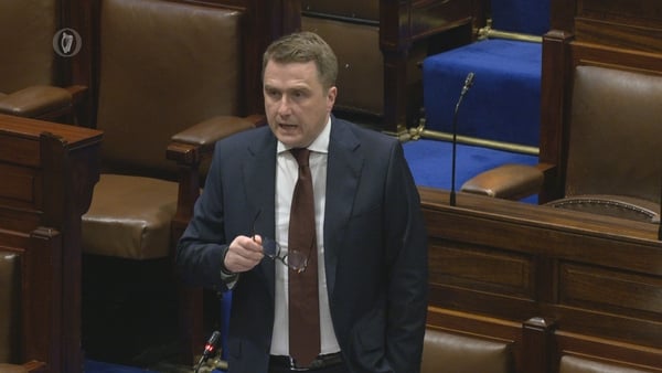 minister james browne gesture with his glasses as he speaks in the Dáil chamber