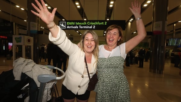 Nora Cummins and her mother Colette Cummins (R) at Dublin Airport after flying from Dubai