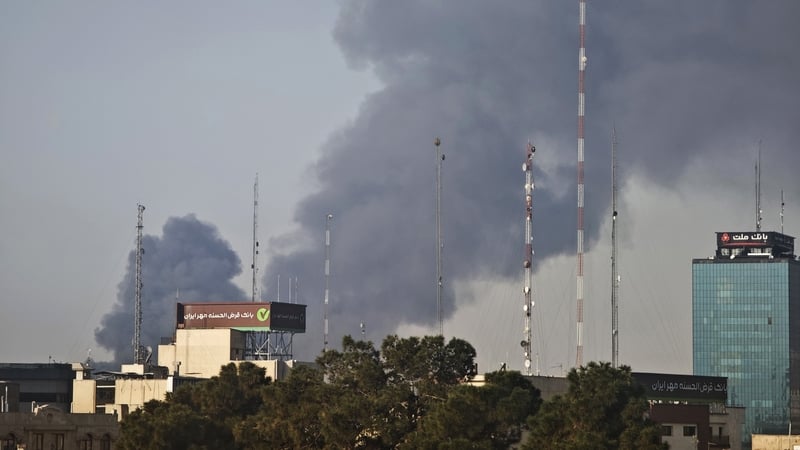 Smoke rises over buildings following explosions