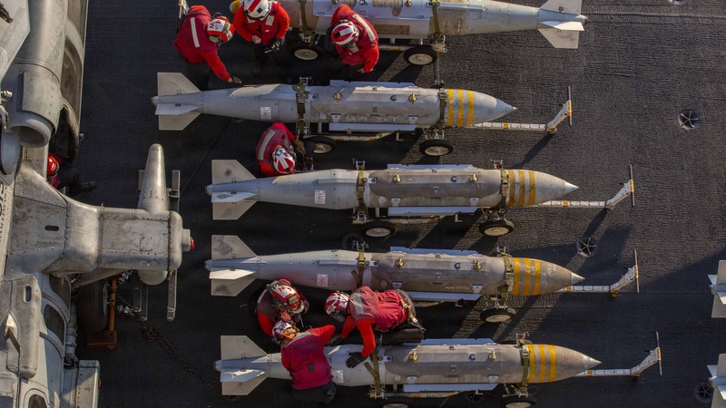 AT SEA, UNSPECIFIED - FEBRUARY 28: (EDITOR'S NOTE: This Handout image was provided by a third-party organization and may not adhere to Getty Images' editorial policy.) In this U.S. Navy released handout, U.S. Sailors prepare to stage ordnance on the fligh