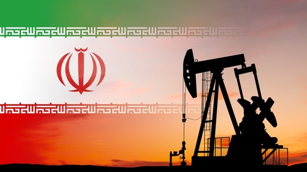 Oil pump with an Iran flag in the background
