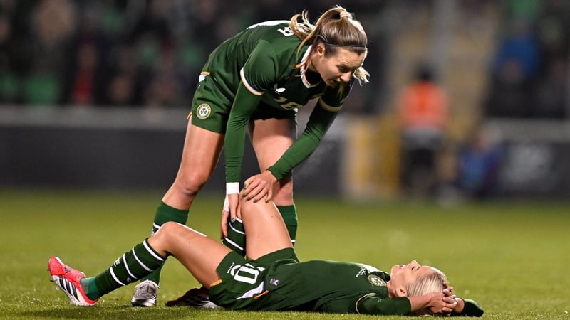 Denise O’Sullivan of Republic of Ireland is checked on by teammate Kyra Carusa during the 2027 FIFA Women’s World Cup Qualifier match between Republic of Ireland and France at Tallaght Stadium in Dublin