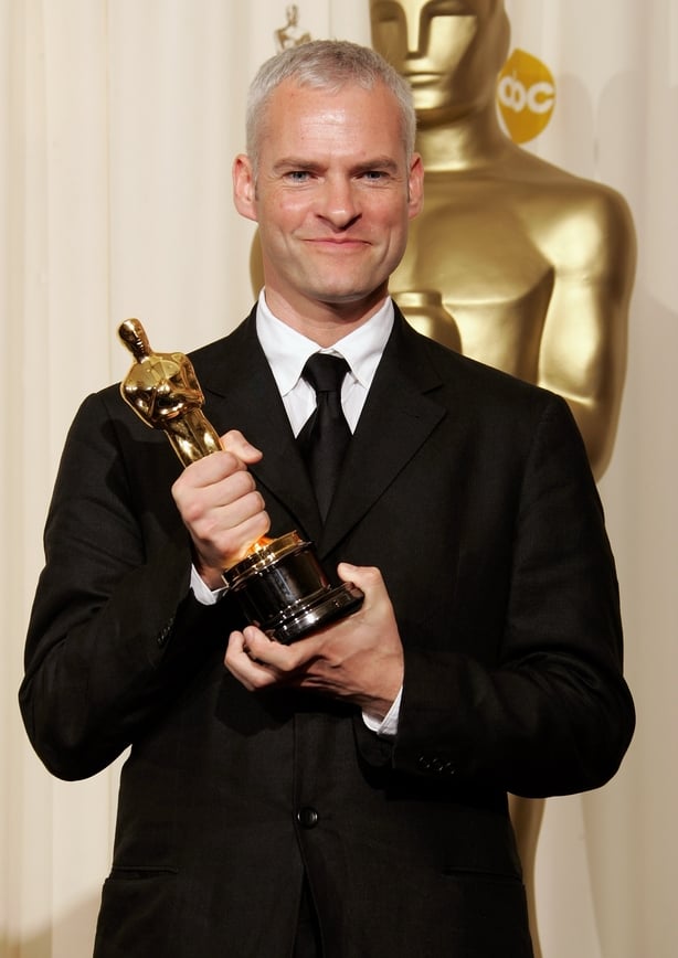 Writer Martin McDonagh poses backstage with his Oscar statuette for Best Live Action Short Film for the film "Six Shooter" during the 78th Annual Academy Awards