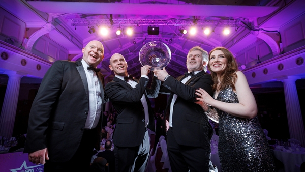 Image of business people accepting an award at an SFA event